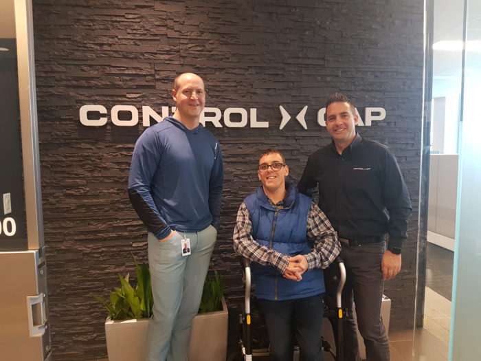 Control Gap Partners, Bruce Duff and Neal Christopher, with Easter Seals participant Casey MacKay at the Control Gap office in Mississauga, ON.